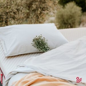 Small bouquet of flowers on the Meridian Daily Hybrid mattress